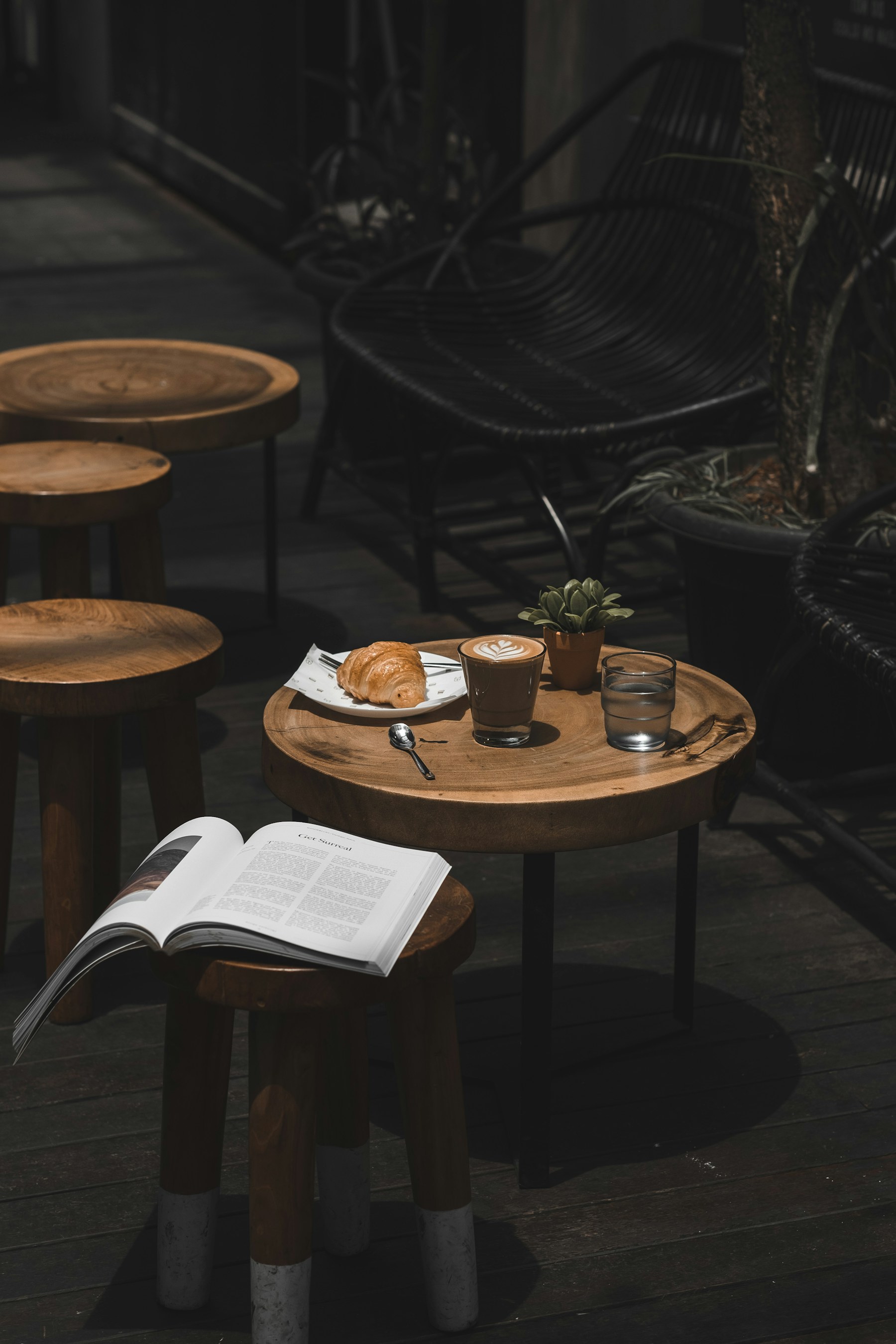 Latte and croissant on a café table